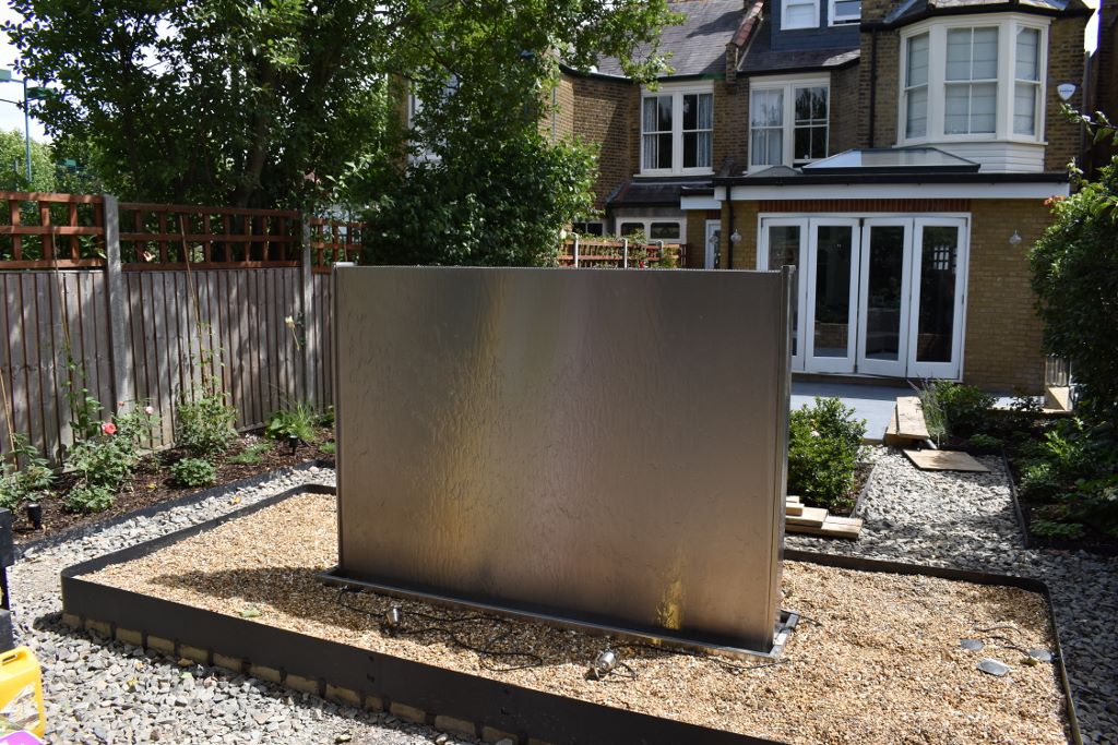 Double sided stainless steel water wall
