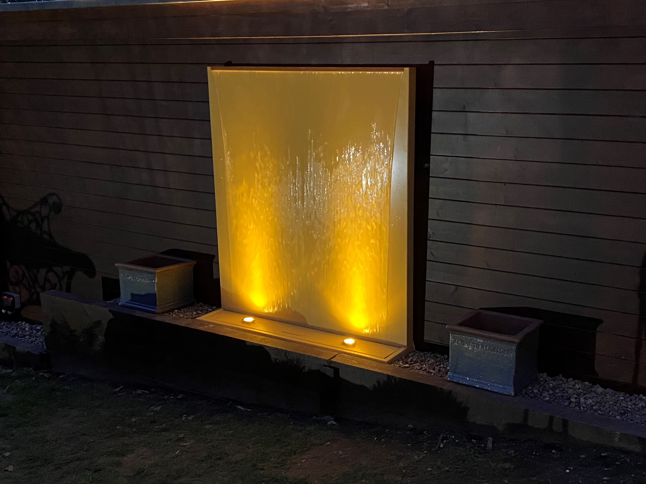 stainless steel water wall feature powder coated in sand yellow