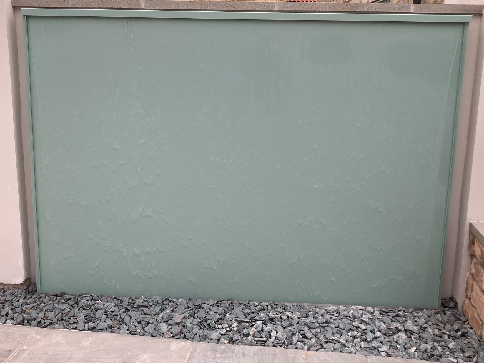 Stainless steel water wall powder coated in chartwell green